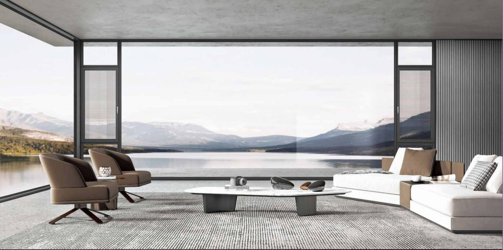 Floor-to-ceiling aluminium casement windows framing a lake and mountains